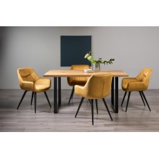 Ramsay Rustic Oak Effect Melamine 6 Seater Dining Table with U Leg  & 4 Dali Mustard Velvet Fabric Chairs with Sand Black Powder Coated Legs