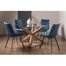 Turin Clear Tempered Glass 4 Seater Dining Table with Light Oak Legs & 4 Fontana Blue Velvet Fabric Chairs with Grey Hand Brushing on Black Powder Coated Legs