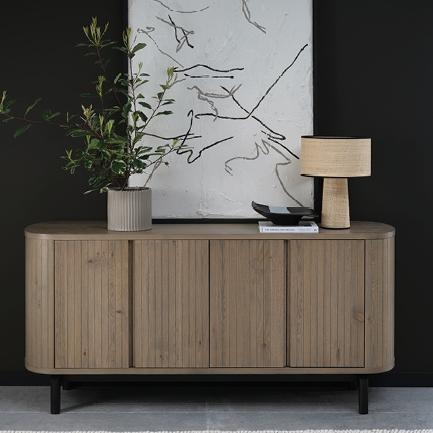 If your storage could use a seasonal refresh, Vega Grey’s sideboard has you covered... literally. S...