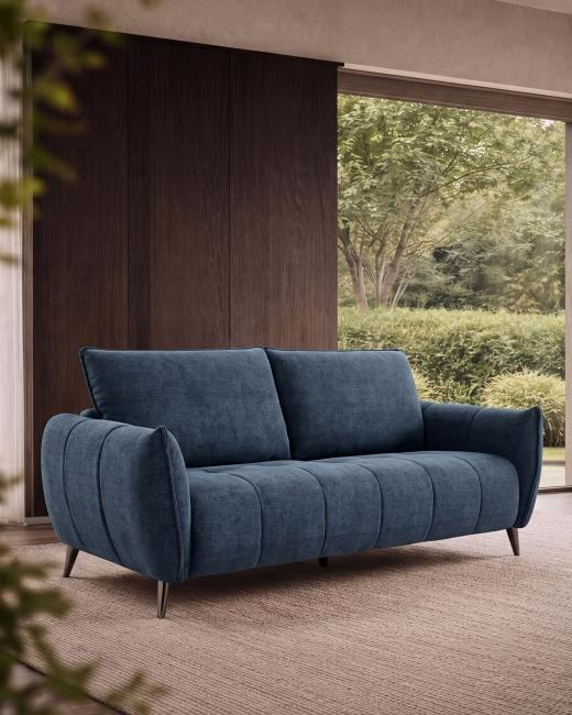 The Elara Three Seater in Teal 🛋️ A softly curved form with supportive seating, black metal legs...