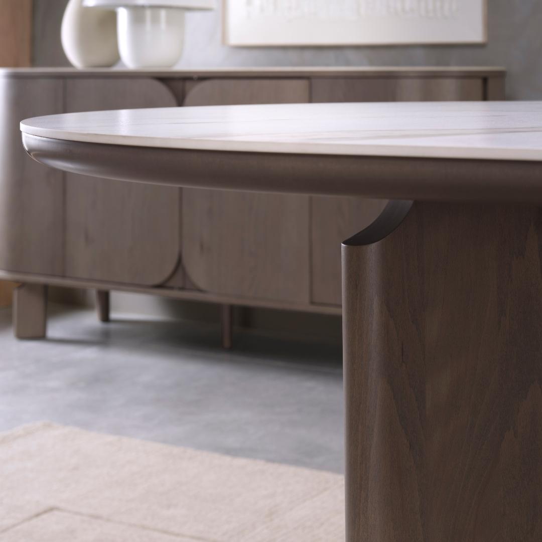 Zoom in. The closer you get, the better it gets. The Duo table brings together a softly rounded sinte...